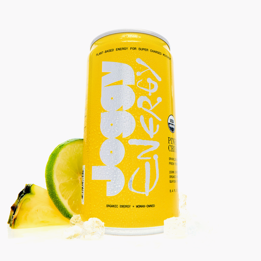 Yellow energy drink can with pineapple and lime slices on a white background