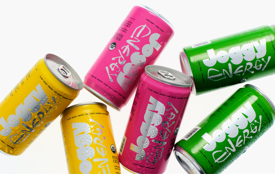 Colorful energy drink cans on a white background