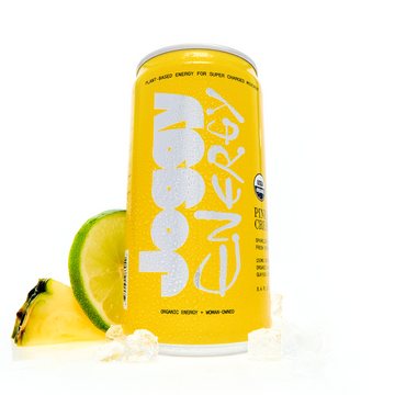 Yellow energy drink can with pineapple and lime slices on a white background